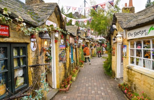Yufuin, Japan - November 22, 2018: Touirsts are walking along shops and stores in Yufuin Floral Village, Japan